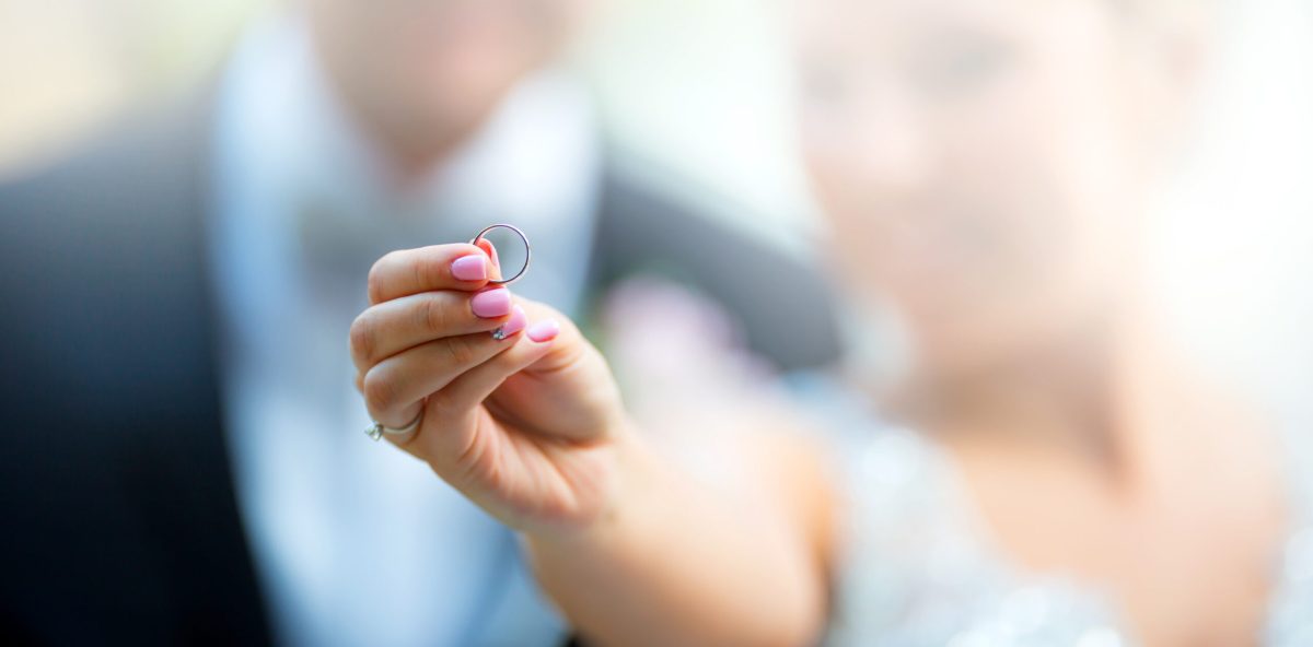 Vecteezy a wedding ring in the bride s hand and the newlyweds in the 30913550 scaled.jpg