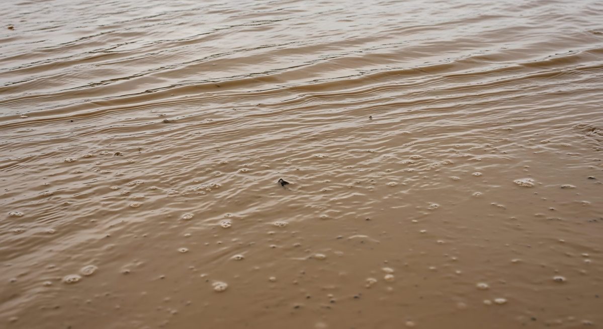 Vecteezy muddy brown water surface with gentle ripples and small air 72828409 scaled.jpg