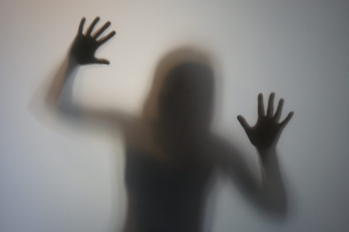 Vecteezy woman silhouette with raised hands behind frosted glass 3713108228129 scaled.jpg