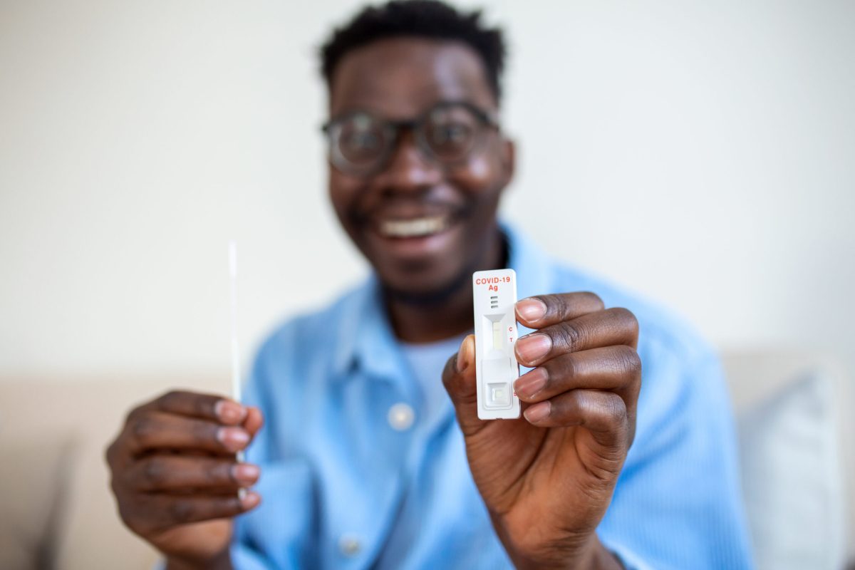 Vecteezy african american man holding a negative test device happy 26595937 6 scaled.jpg