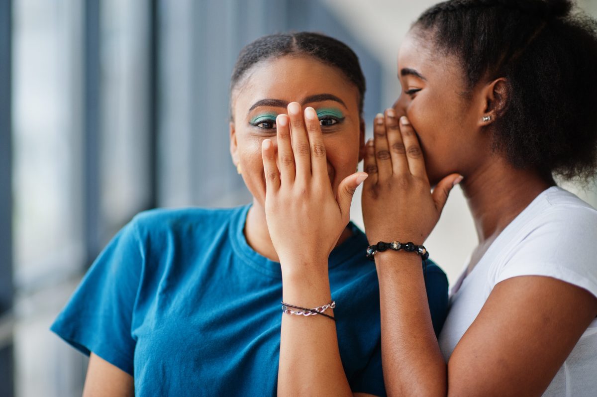 Vecteezy two african woman friends in t shirts whispers gossip indoor 10582195 scaled.jpg