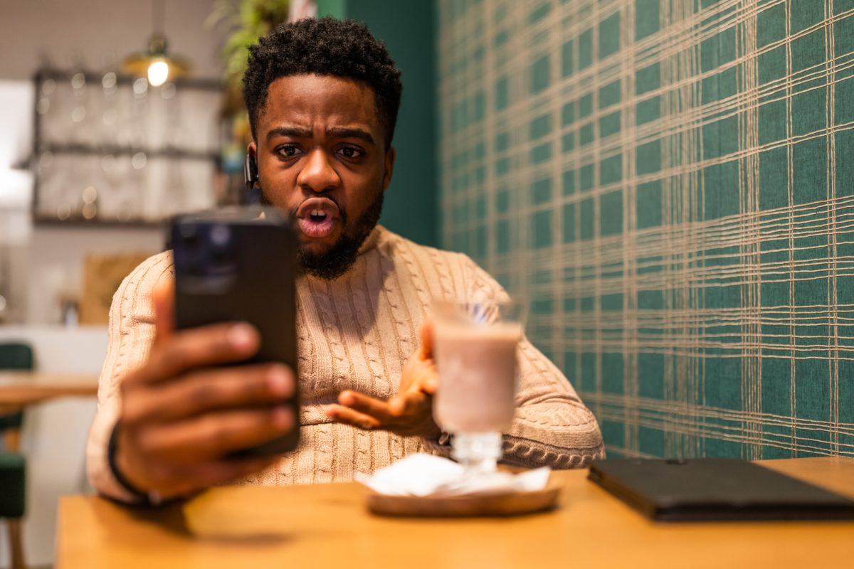 Vecteezy young black man in cafe having an online voice call looking 63529080 scaled.jpg