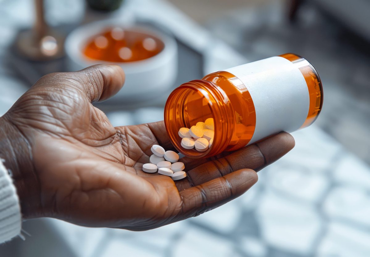 Vecteezy close up of person s hand holding bottle of pills 47129867 scaled.jpg