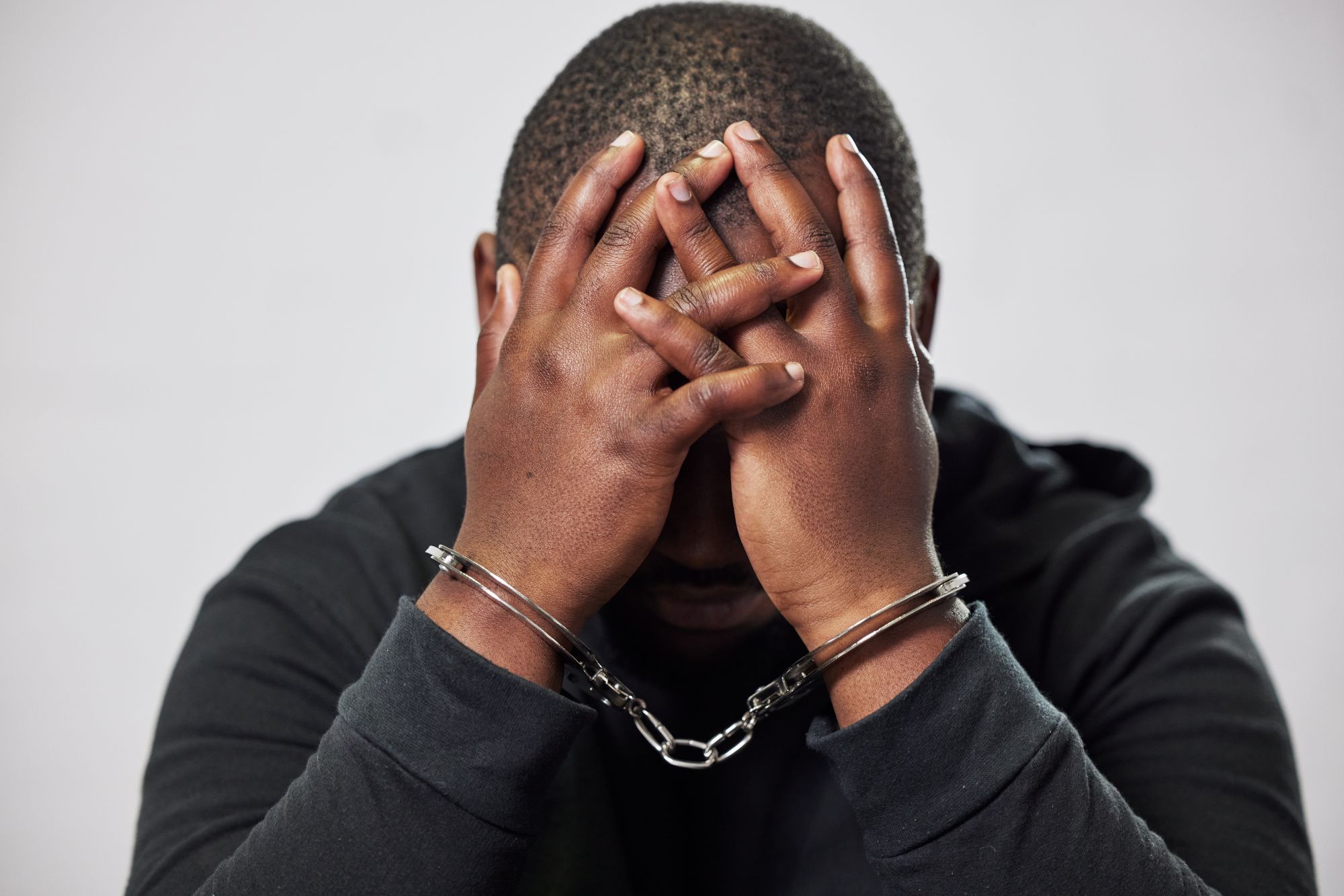 Vecteezy handcuffs arrested criminal and black man with stress 75980688 24816623215350552003.jpg