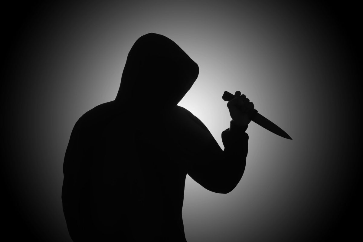 Vecteezy mysterious man wearing black hoodie holding a knife to stab 2410113428229 2 scaled.jpg