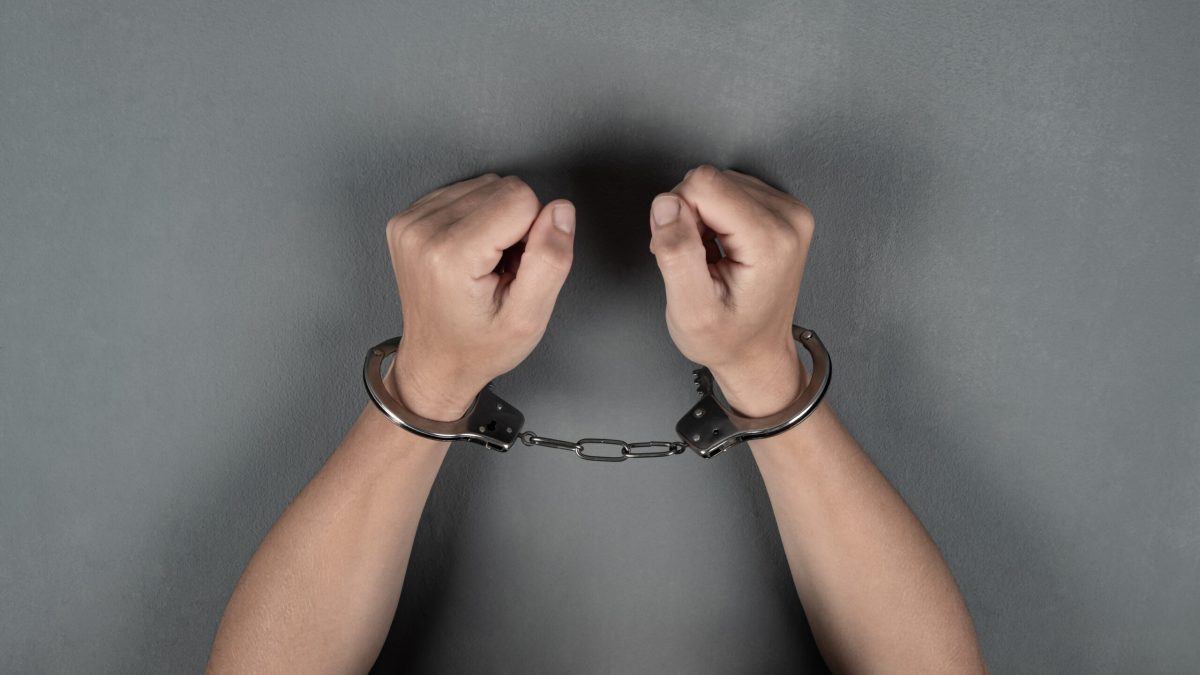 Vecteezy woman s hands are handcuffed against a gray wall 3313781 scaled.jpg