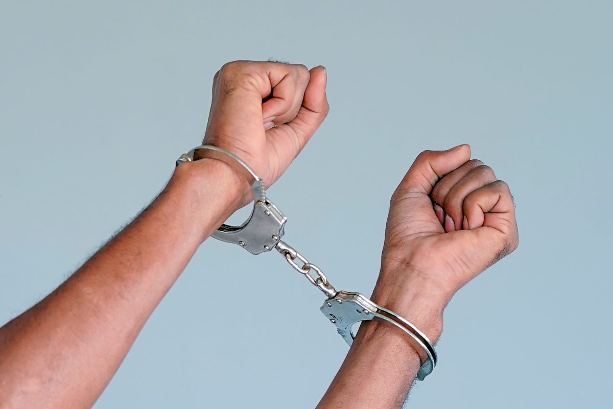 Vecteezy criminal hands locked in handcuffs prisoner or arrested 69343603 1 scaled.jpg