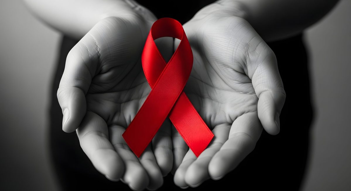 Vecteezy hands holding vibrant red aids awareness ribbon in black and 74755766 scaled.jpg