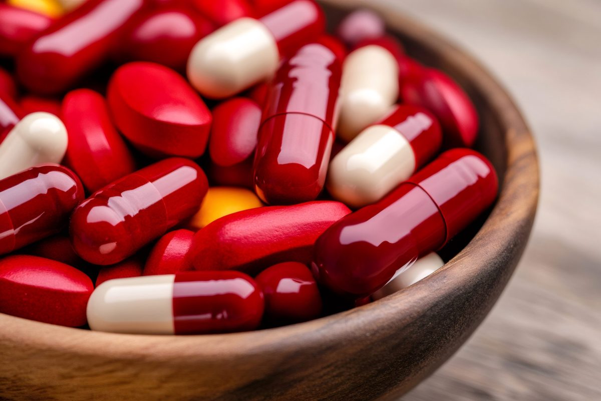 Vecteezy wooden bowl overflowing with colorful capsules and pills 60531404 scaled.jpg
